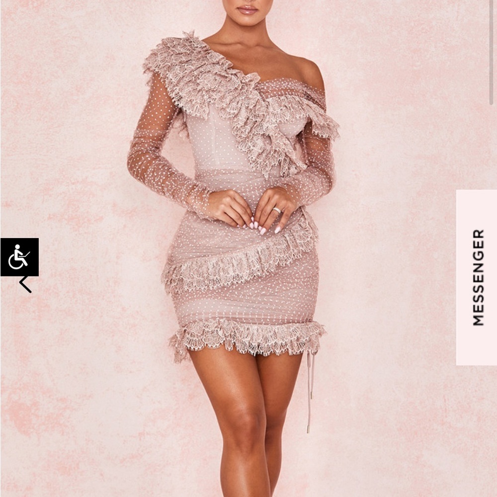 Brand New With Tags. Never worn, purchased for a wedding I did not make it to.
